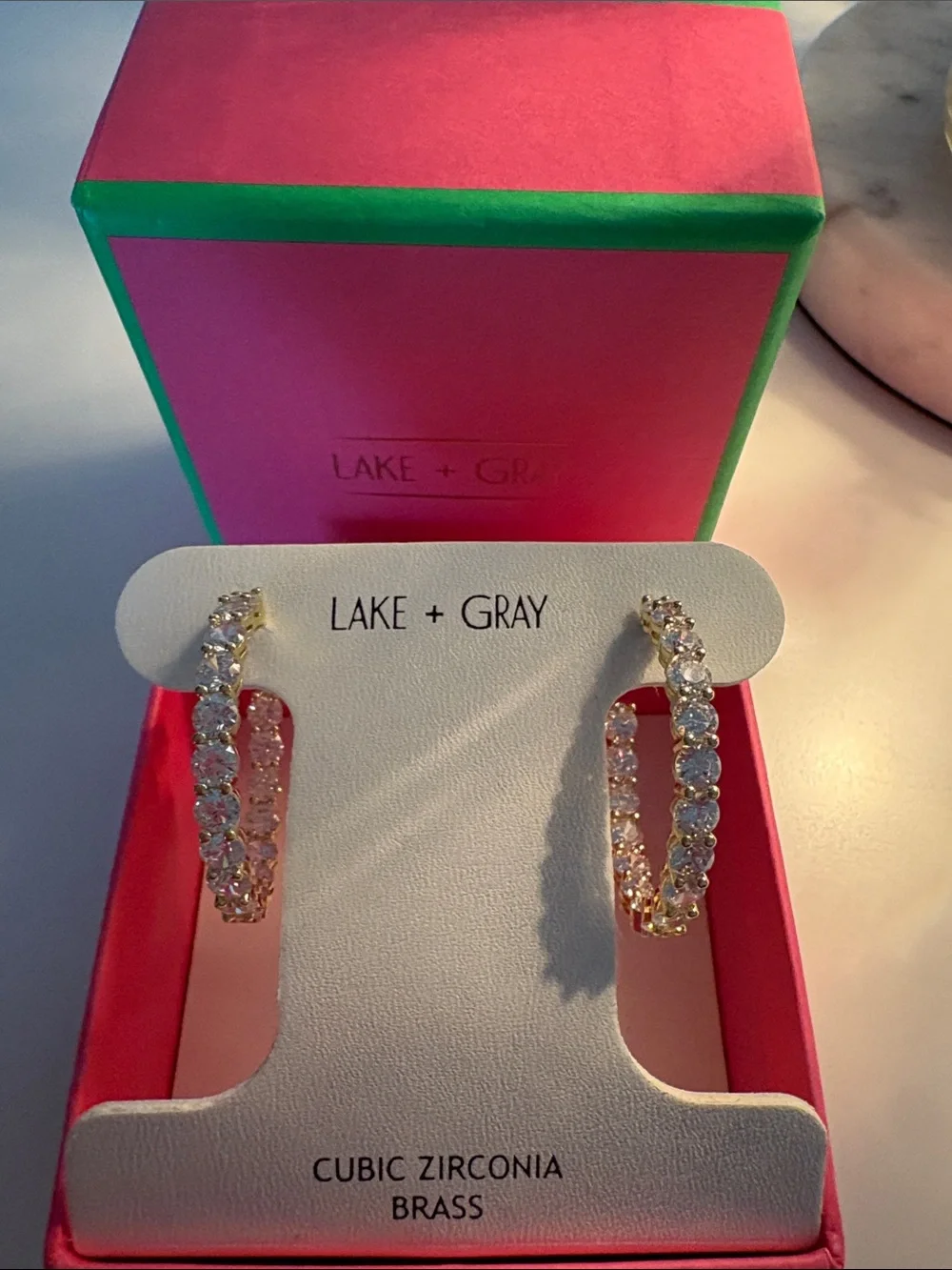 New in box Lake and Gray Gold/CZ Stone earrings